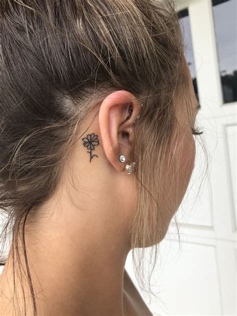 behind the ear tattoos women|small flower tattoo behind ear.